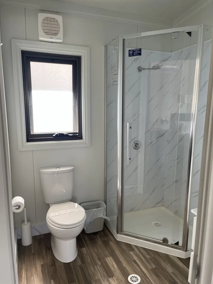 Spotless ensuite bathroom with shower