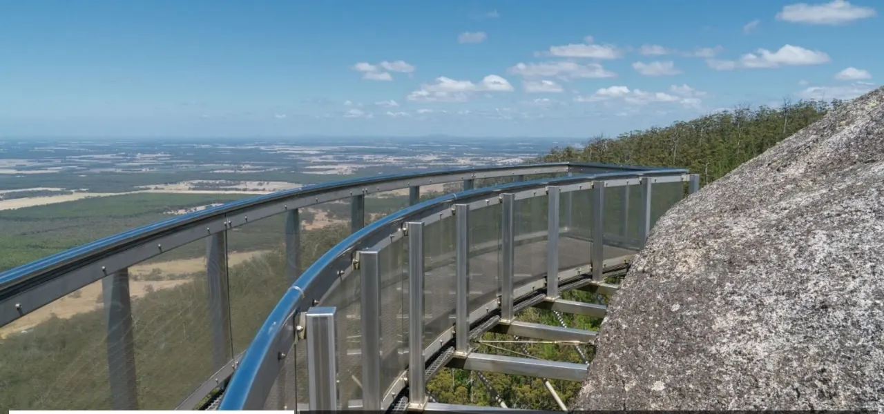 The Granite Skywalk walkway curving around a massive granite boulder in Porongurup National Park