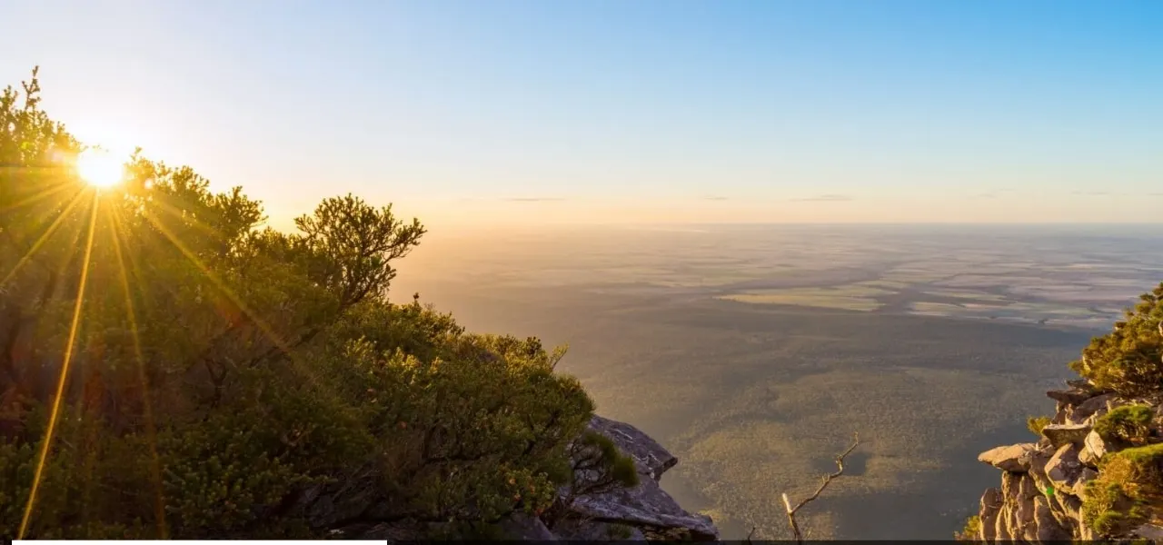Sunrise over the farmland plains below, seen from a rocky summit in the Stirling Range